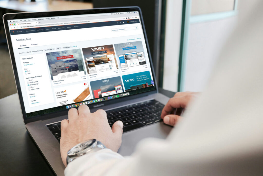 Man optimizing laptop for web design
